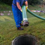 Emptying,household,septic,tank.,cleaning,and,unblocking,clogged,drain,with