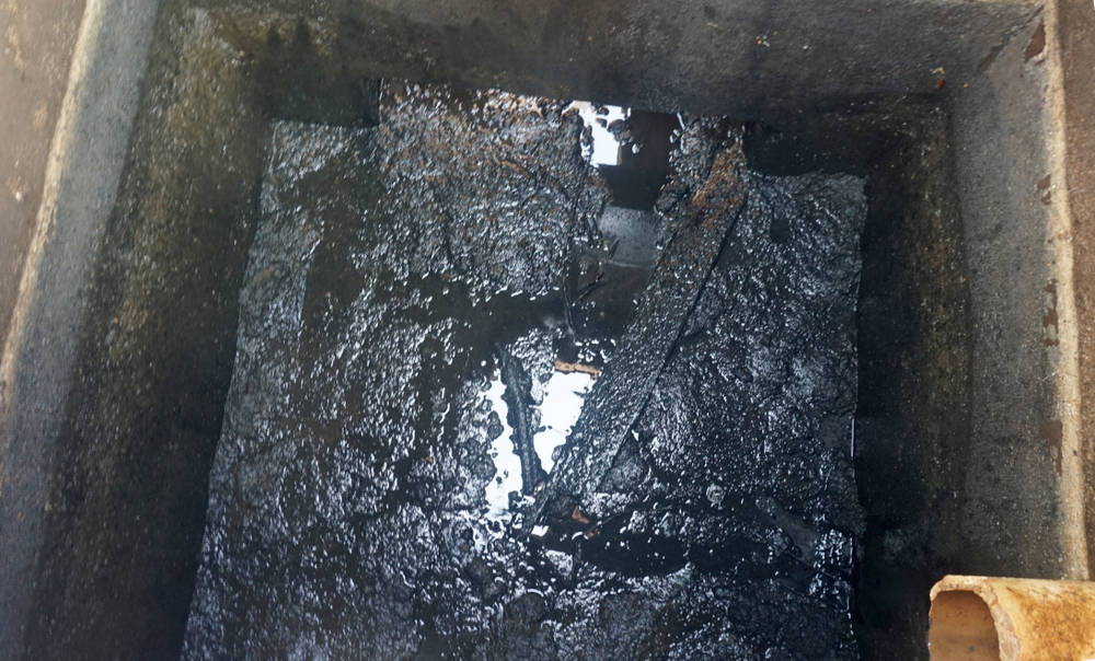 Opened,manhole,showing,the,inside,of,a,home,septic,tank